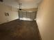 Attached garage with automatic opener and concrete floor at 5750 Old Carriage Dr, Atlanta, GA 30349