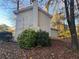 Side view of house showing yellow siding and landscaping at 1182 Bailing Dr, Lawrenceville, GA 30043