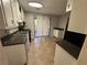 Kitchen features tile floor and white cabinets at 1182 Bailing Dr, Lawrenceville, GA 30043