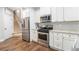 Modern kitchen with stainless steel appliances and granite countertops at 141 Legends Way, Hiram, GA 30141
