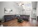 Large living room with hardwood floors, sectional sofa, and vaulted ceiling at 141 Legends Way, Hiram, GA 30141