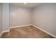 Simple bedroom with neutral walls and brown carpet at 138 Slippery Rock Ct, Villa Rica, GA 30180
