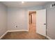Cozy bedroom with carpet and access to hallway at 138 Slippery Rock Ct, Villa Rica, GA 30180