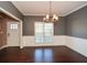 Elegant dining room with hardwood floors and chandelier at 138 Slippery Rock Ct, Villa Rica, GA 30180