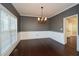 Bright dining room with hardwood floors and chandelier at 138 Slippery Rock Ct, Villa Rica, GA 30180