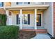 House exterior with covered porch and landscaping at 138 Slippery Rock Ct, Villa Rica, GA 30180