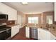 Kitchen with granite countertops and stainless steel appliances at 138 Slippery Rock Ct, Villa Rica, GA 30180