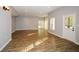 Spacious living room featuring hardwood floors and multiple windows at 138 Slippery Rock Ct, Villa Rica, GA 30180