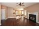 Hardwood floor living room with fireplace and view into kitchen at 138 Slippery Rock Ct, Villa Rica, GA 30180