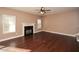 Spacious living room with hardwood floors and fireplace at 138 Slippery Rock Ct, Villa Rica, GA 30180