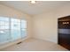 Bright home office features large window with blinds and carpet flooring at 138 Slippery Rock Ct, Villa Rica, GA 30180