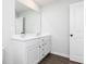 Double vanity bathroom with modern fixtures and dark floors at 505 Altamaha Cir, Locust Grove, GA 30248