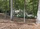 View of house from wooded backyard at 3771 Club Nw Dr, Kennesaw, GA 30144