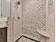 Walk-in shower with patterned tile and built-in seat at 3771 Club Nw Dr, Kennesaw, GA 30144