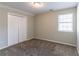 Bright bedroom with double door closet and carpet at 6016 King Way Walk, Lithonia, GA 30058