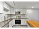 Modern kitchen with stainless steel appliances and white shaker cabinets at 89 Chaumont Nw Sq, Atlanta, GA 30327