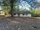 Ranch house with mature trees and a large yard at 383 River Rd, Jonesboro, GA 30236