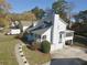 White house with gray roof, screened porch, and yard at 4207 Alaina Cir, Austell, GA 30106