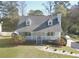 White house with gray roof, front porch, and landscaping at 4207 Alaina Cir, Austell, GA 30106