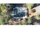 Aerial view of property showing a private pool and surrounding trees at 2237 Gunstock Dr, Stone Mountain, GA 30087