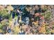 Bird's-eye view of house, wooded lot, and tennis court at 2237 Gunstock Dr, Stone Mountain, GA 30087