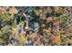 Bird's-eye view of house, wooded lot, and tennis court at 2237 Gunstock Dr, Stone Mountain, GA 30087