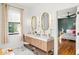 Spa-like bathroom with double vanity and stylish light fixtures at 2237 Gunstock Dr, Stone Mountain, GA 30087