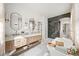 Elegant bathroom featuring a walk-in shower and free-standing tub at 2237 Gunstock Dr, Stone Mountain, GA 30087