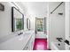 Stylish bathroom with double vanity, hexagon tile floor and a bathtub at 2237 Gunstock Dr, Stone Mountain, GA 30087