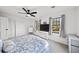 Spacious bedroom with ceiling fan, large windows, and ample closet space at 2237 Gunstock Dr, Stone Mountain, GA 30087