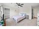 Cozy bedroom featuring a queen bed, built-in shelving, and a ceiling fan at 2237 Gunstock Dr, Stone Mountain, GA 30087