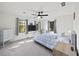 Bright bedroom with ceiling fan, large windows, and ample closet space at 2237 Gunstock Dr, Stone Mountain, GA 30087