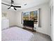 Spacious bedroom with a plush bed, large windows offering natural light, and a TV stand at 2237 Gunstock Dr, Stone Mountain, GA 30087