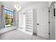Spacious walk-in closet with window and custom built-ins at 2237 Gunstock Dr, Stone Mountain, GA 30087