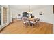 Open concept dining room with hardwood floors, offering views of living room and kitchen at 2237 Gunstock Dr, Stone Mountain, GA 30087