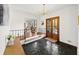 Spacious entryway with dark tile floors and a modern chandelier at 2237 Gunstock Dr, Stone Mountain, GA 30087