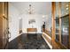 Bright entryway with dark tile floors and mid-century modern decor at 2237 Gunstock Dr, Stone Mountain, GA 30087