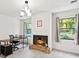 Home office with a fireplace, desk, and plenty of natural light at 2237 Gunstock Dr, Stone Mountain, GA 30087