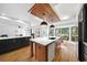 Modern kitchen with an island, breakfast area, and hardwood floors at 2237 Gunstock Dr, Stone Mountain, GA 30087