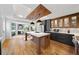 Renovated kitchen with island, stainless steel appliances, and hardwood floors at 2237 Gunstock Dr, Stone Mountain, GA 30087