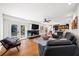 Relaxing living room featuring hardwood floors, fireplace, and access to backyard at 2237 Gunstock Dr, Stone Mountain, GA 30087