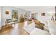 Living room with hardwood floors, white sectional, and large windows at 2237 Gunstock Dr, Stone Mountain, GA 30087