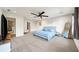 Spacious main bedroom with carpeted floor and ceiling fan at 2237 Gunstock Dr, Stone Mountain, GA 30087