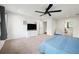 Main bedroom with large TV, ceiling fan, and ample space at 2237 Gunstock Dr, Stone Mountain, GA 30087