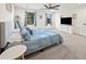 Main bedroom with large bed, plenty of natural light, and a ceiling fan at 2237 Gunstock Dr, Stone Mountain, GA 30087