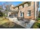 Outdoor patio with seating for dining and lounging under a pergola at 2237 Gunstock Dr, Stone Mountain, GA 30087