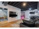 Finished basement recreation area with large TV and wet bar at 5088 Riverview Rd, Atlanta, GA 30327