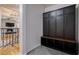 Modern entryway with built-in storage bench and cabinets at 5088 Riverview Rd, Atlanta, GA 30327