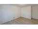 Simple bedroom with wood-look floors and neutral walls at 4639 Hardwood Rd, Stone Mountain, GA 30083