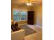 Cozy bedroom featuring a window and built-in shelves at 3668 Deer Springs Pkwy, Ellenwood, GA 30294